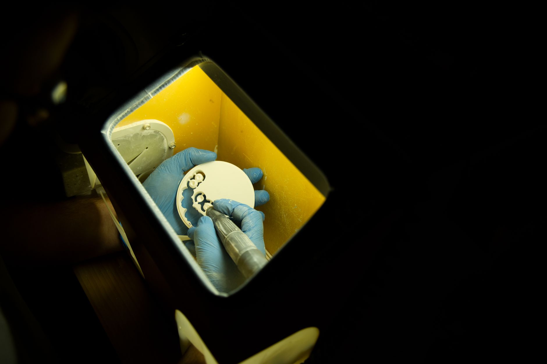 Dental lab technician crafting custom crowns and dental prosthetics