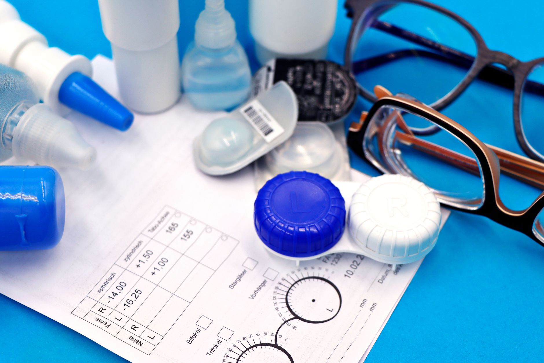 Woman with astigmatism trying on colored toric contact lenses in eye care office