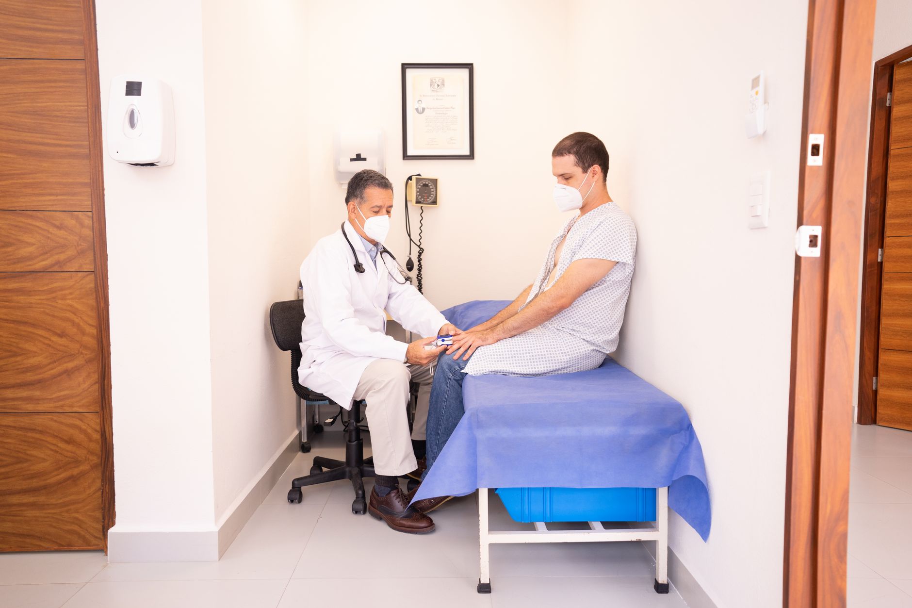 Doctor explaining cholesterol levels and heart health with medical chart