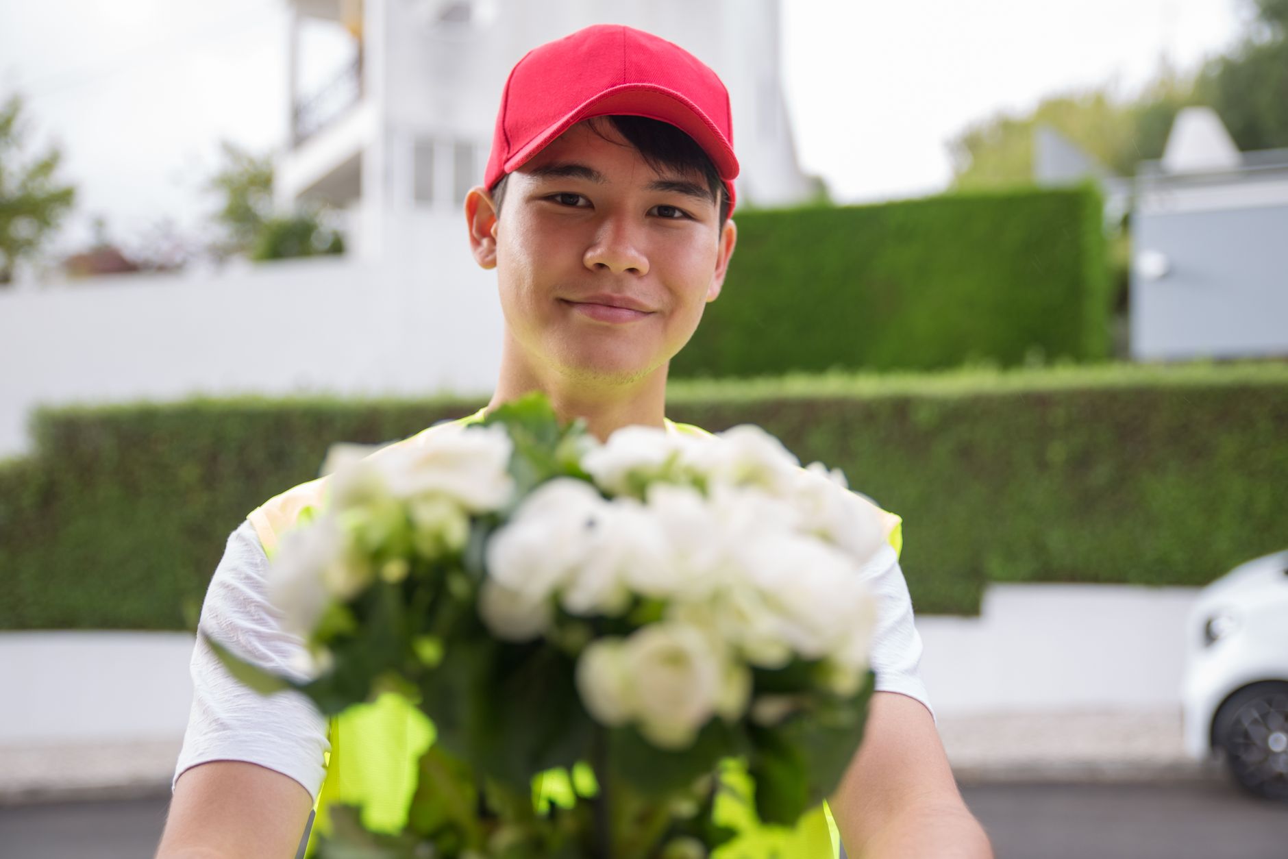 Fresh flower bouquet being delivered to doorstep by florist