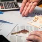 Estate planning documents with calculator showing financial planning strategy