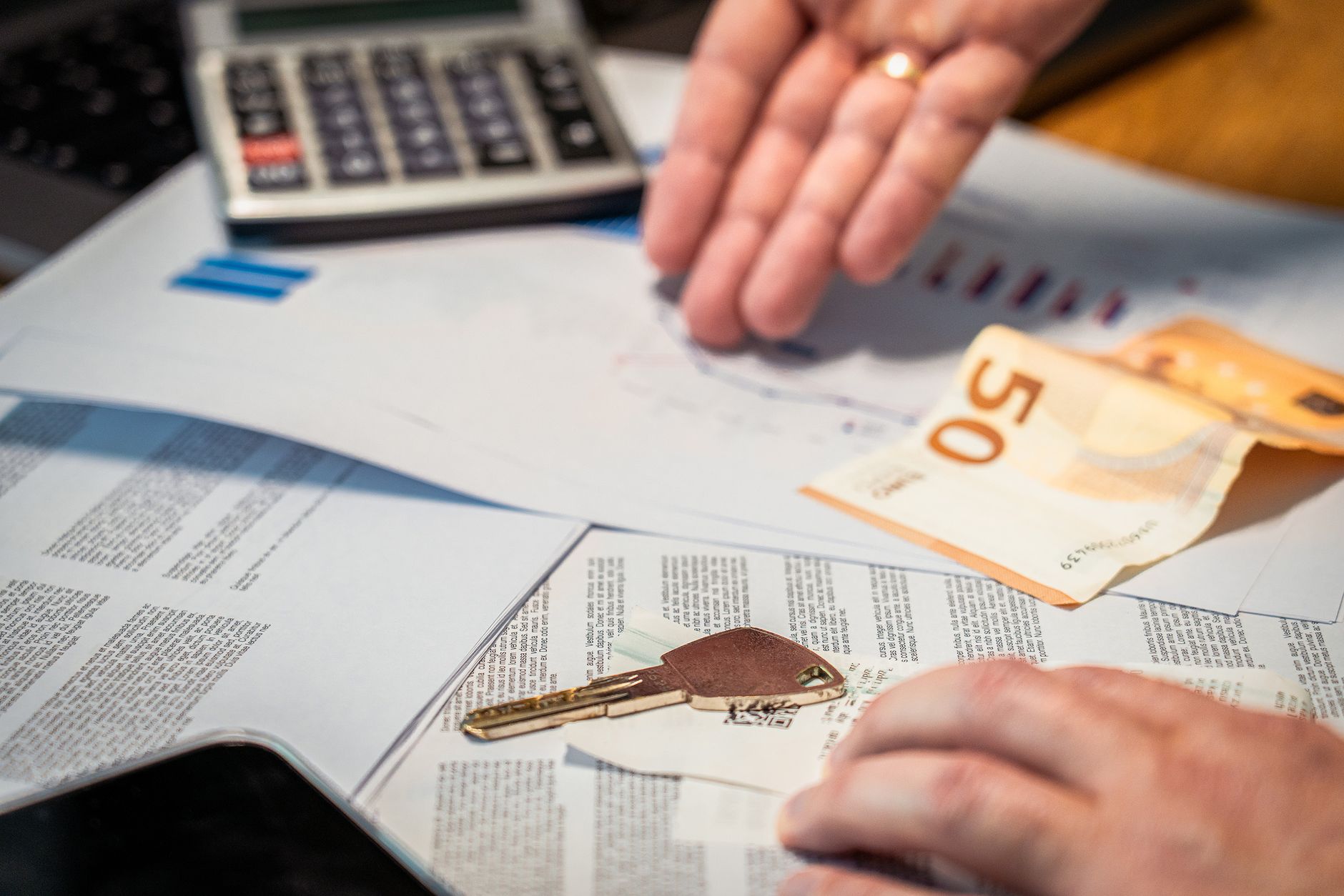 Estate planning documents with calculator showing financial planning strategy