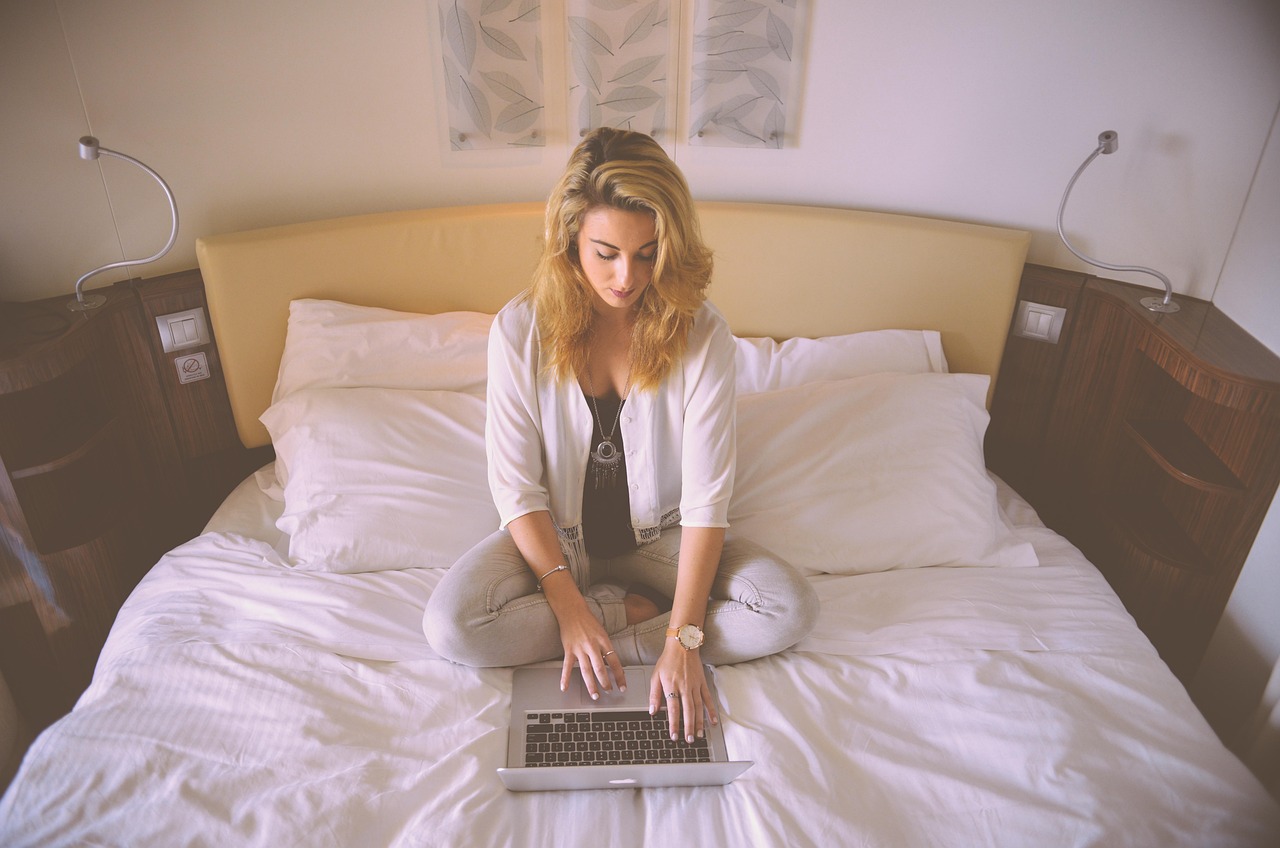 Man working at desk with laptop earning extra income steadily