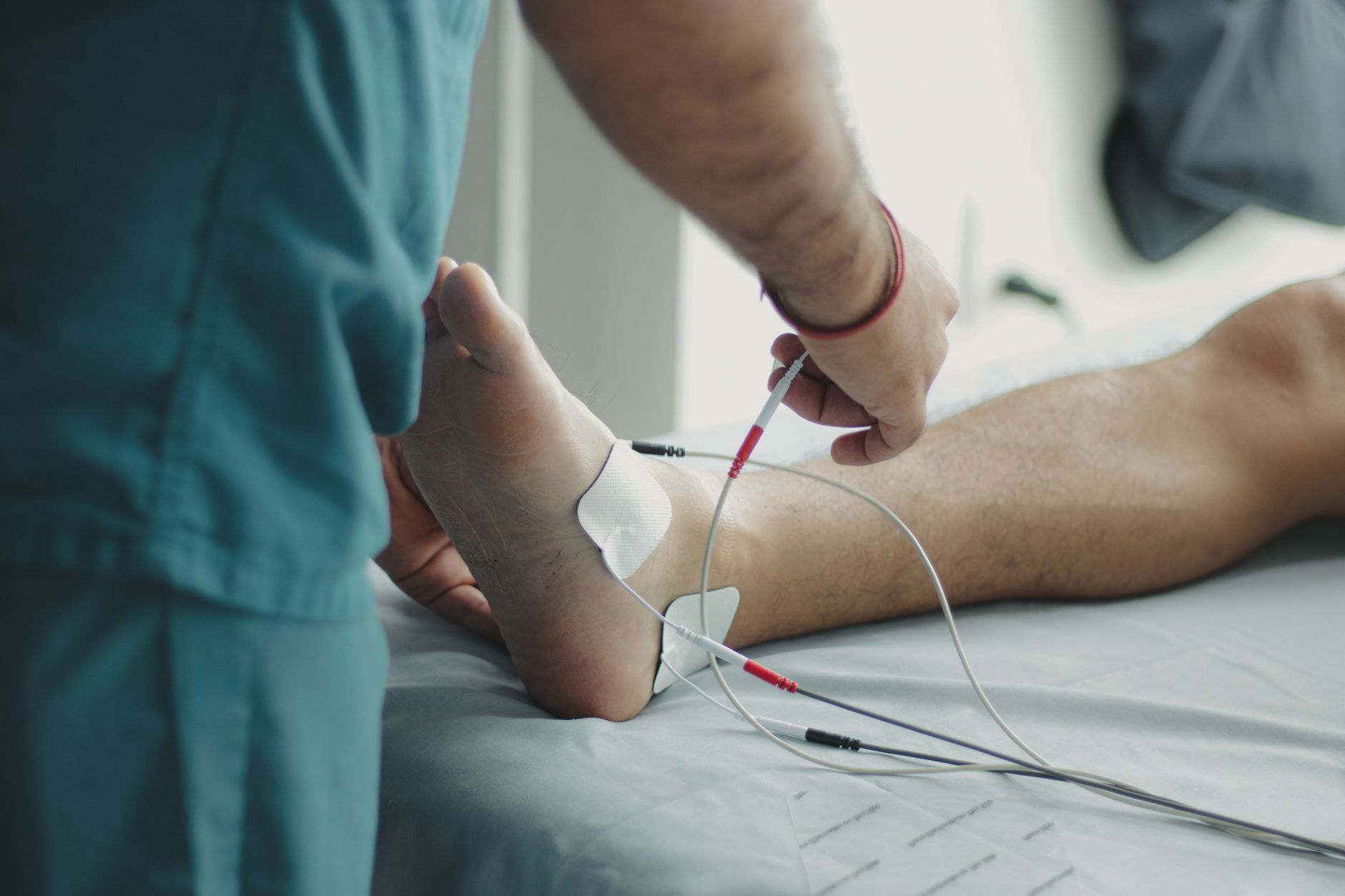 Close-up view of foot wound examination showing redness, swelling, and infection signs