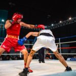 Boxing match streaming on tablet showing live international tournament fight
