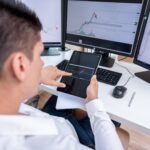 Person analyzing financial chart with disposable income and trading concept
