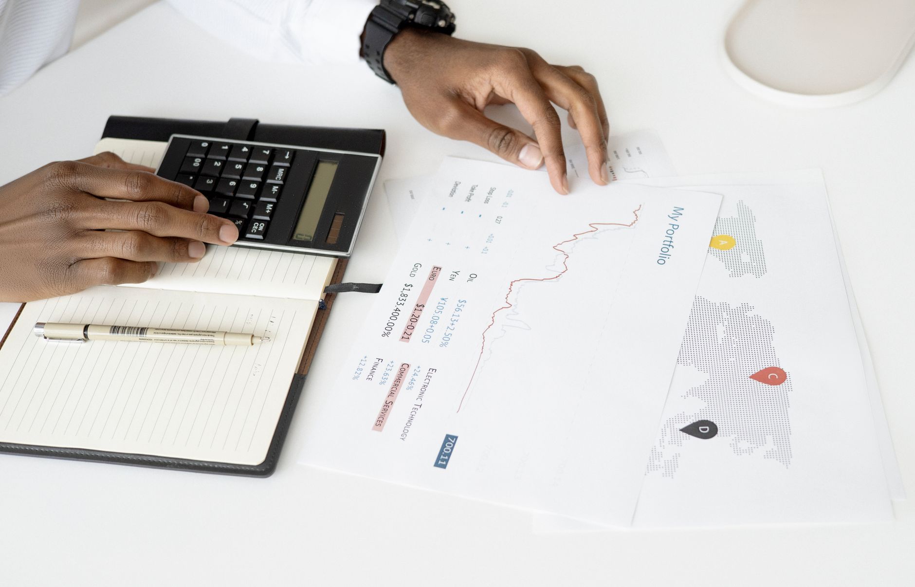 Financial advisor reviewing investment portfolio and tax strategy documents