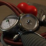 Doctor measuring patient blood pressure during cardiovascular health checkup consultation