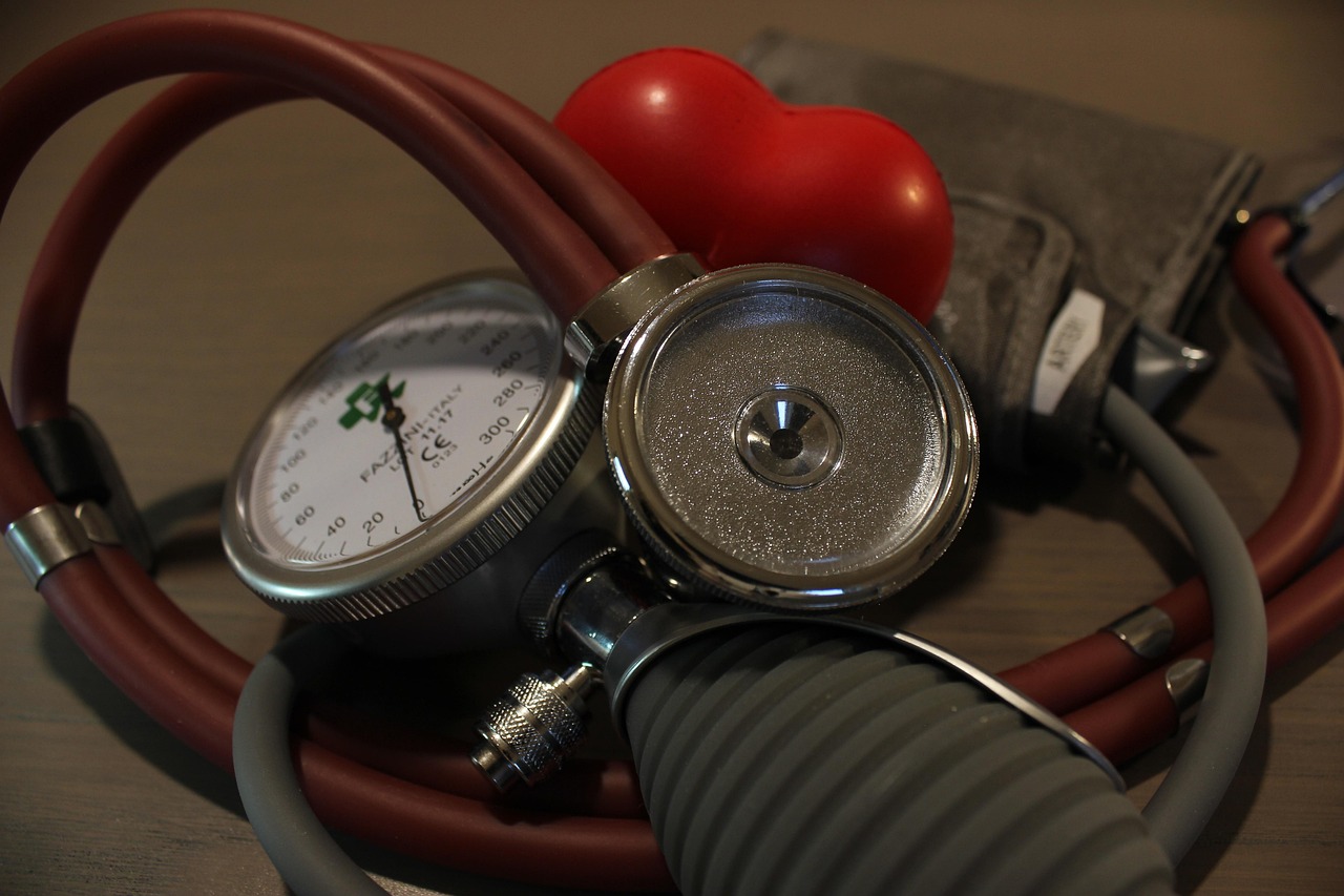 Doctor measuring patient blood pressure during cardiovascular health checkup consultation