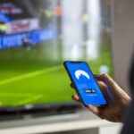 Football fan watching live NFL game stream on Reddit platform