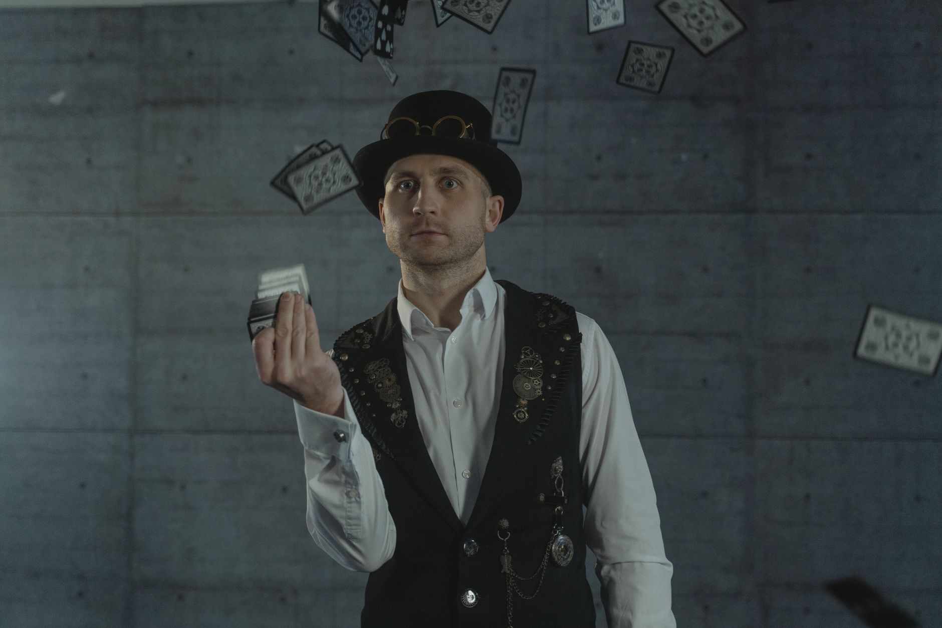 Magician performing card trick with deck of playing cards