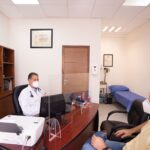 Doctor reviewing heart health prevention strategies with patient during consultation