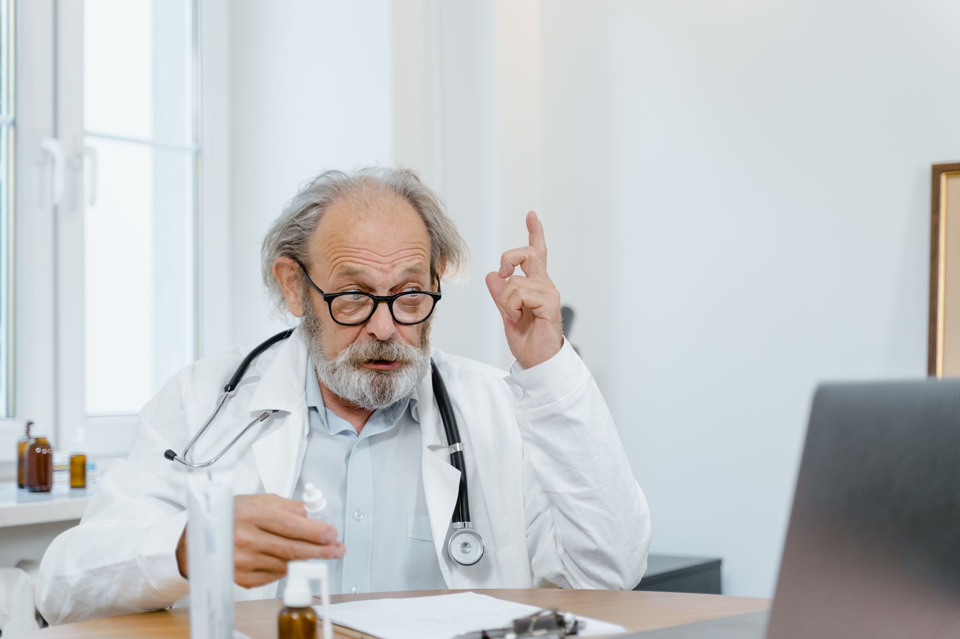 Doctor consultation for testosterone replacement therapy on computer screen