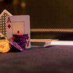 Person holding coins on digital gambling platform interface