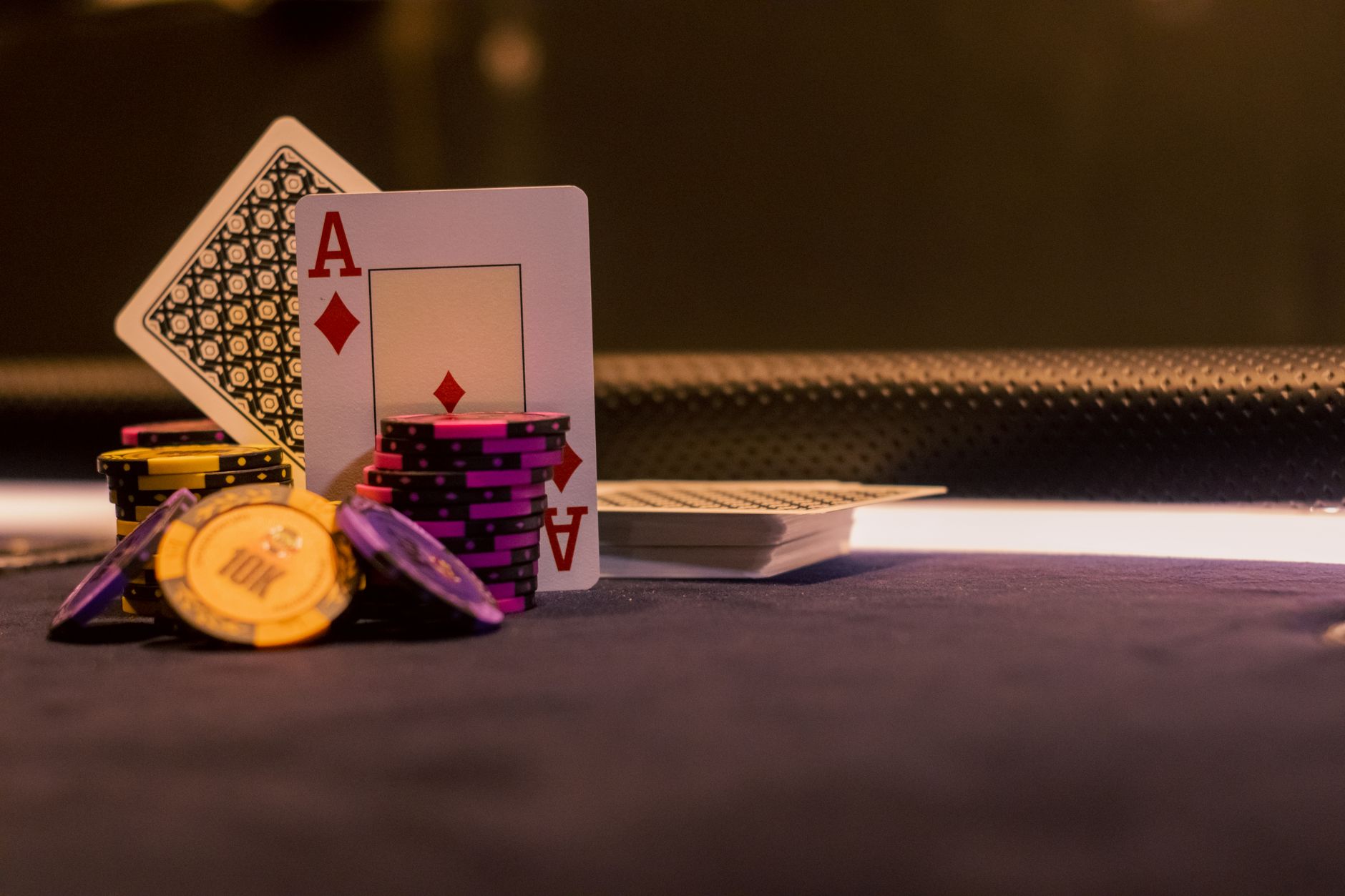 Person holding coins on digital gambling platform interface