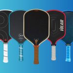 A collection of various pickleball paddles displayed against a vibrant blue background.